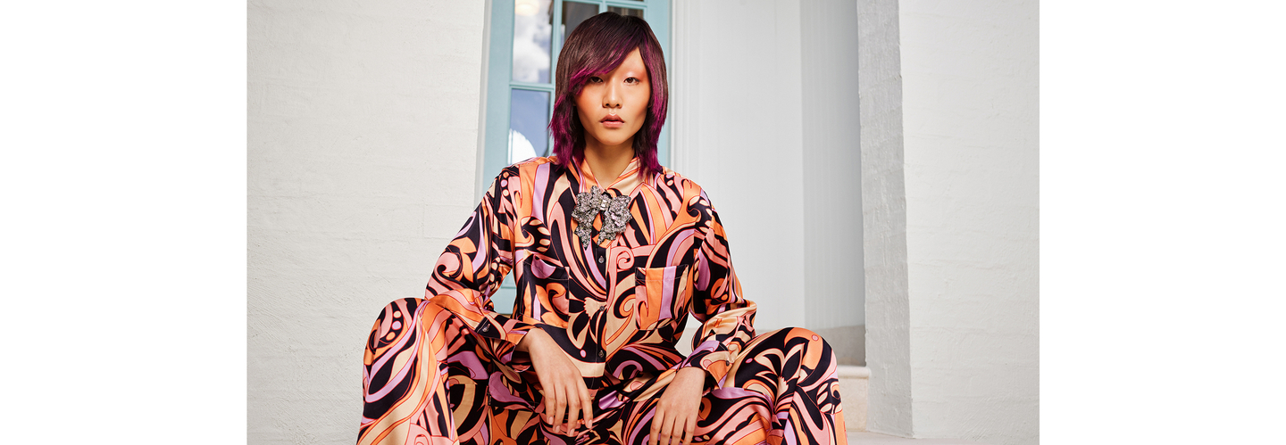 Woman with vibrant, rejuvenated hair showcasing the effect of the KEVIN.MURPHY REJUVENATE regimen.